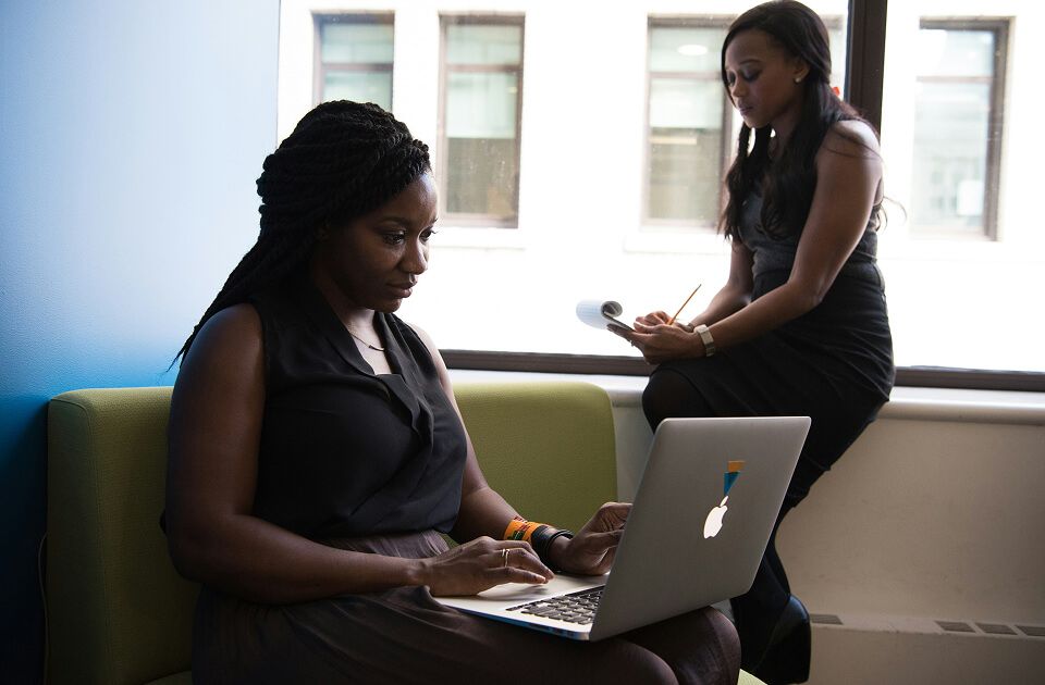 Two professionals working in an office.