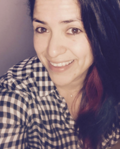 Smiling adult woman looking at the camera.