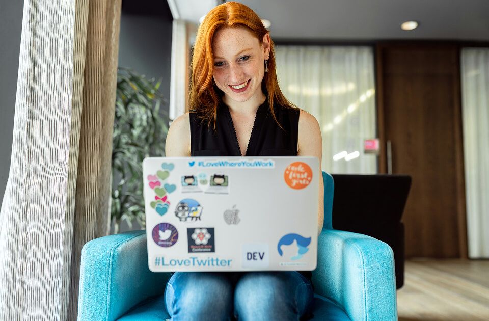 Female student working on a laptop.