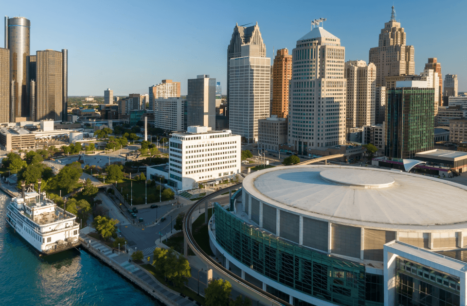 Downtown Detroit skyline along the riverfront, skyscrapers and waterfront buildings.