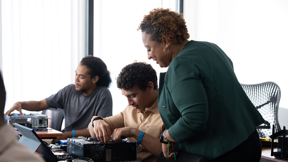 Instructor engaging with student in classroom